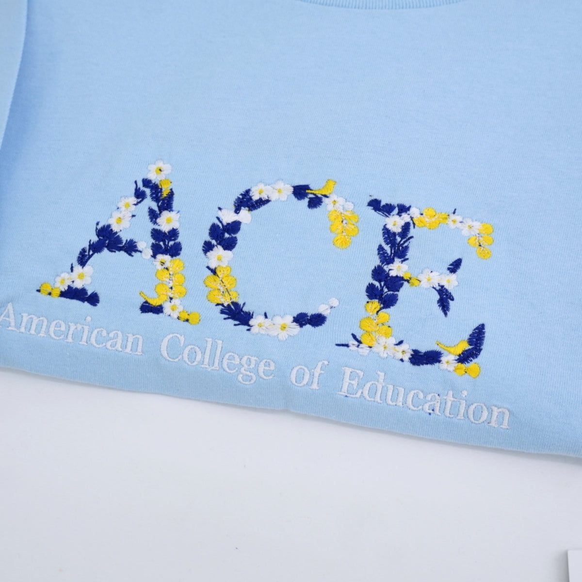Floral Letter Custom Embroidered T-Shirt - University College Colors - School Spirit Gift
